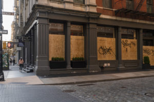 An image of a boarded up shop in Manhattan.