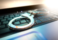 Handcuffs on top of a keyboard